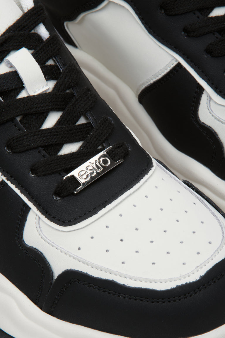 Damskie, skórzane sneakersy czarno-białe marki Estro - zbliżenie na detale.