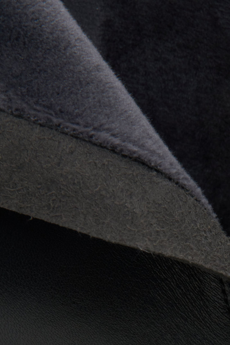 Damskie, skórzane botki na obcasie w kolorze czarnym marki Estro - zbliżenie na detale.