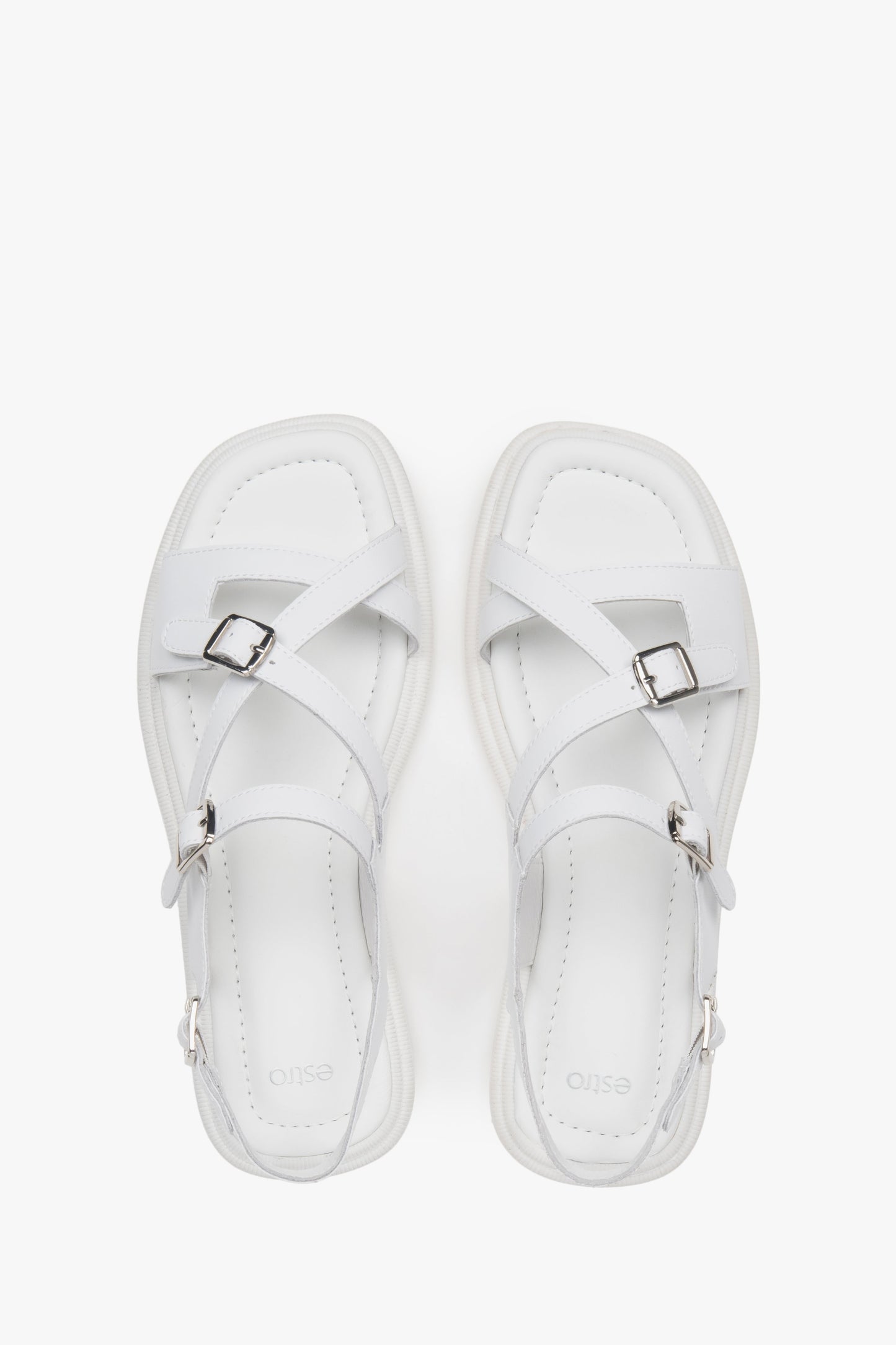 Damskie białe sandały na płaskiej podeszwie ze skóry naturalnej Estro.