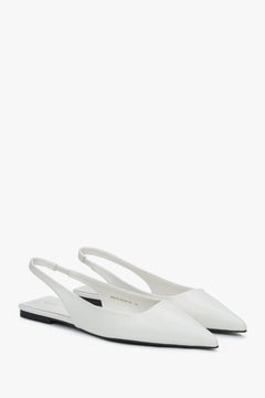 Białe sandały damskie na płaskim obcasie ze skóry naturalnej typu slingback.