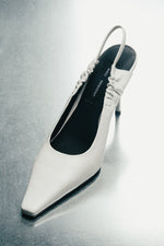 Mlecznobiałe czółenka z odkrytą piętą ze skóry naturalnej Estro Selection ER00119184.