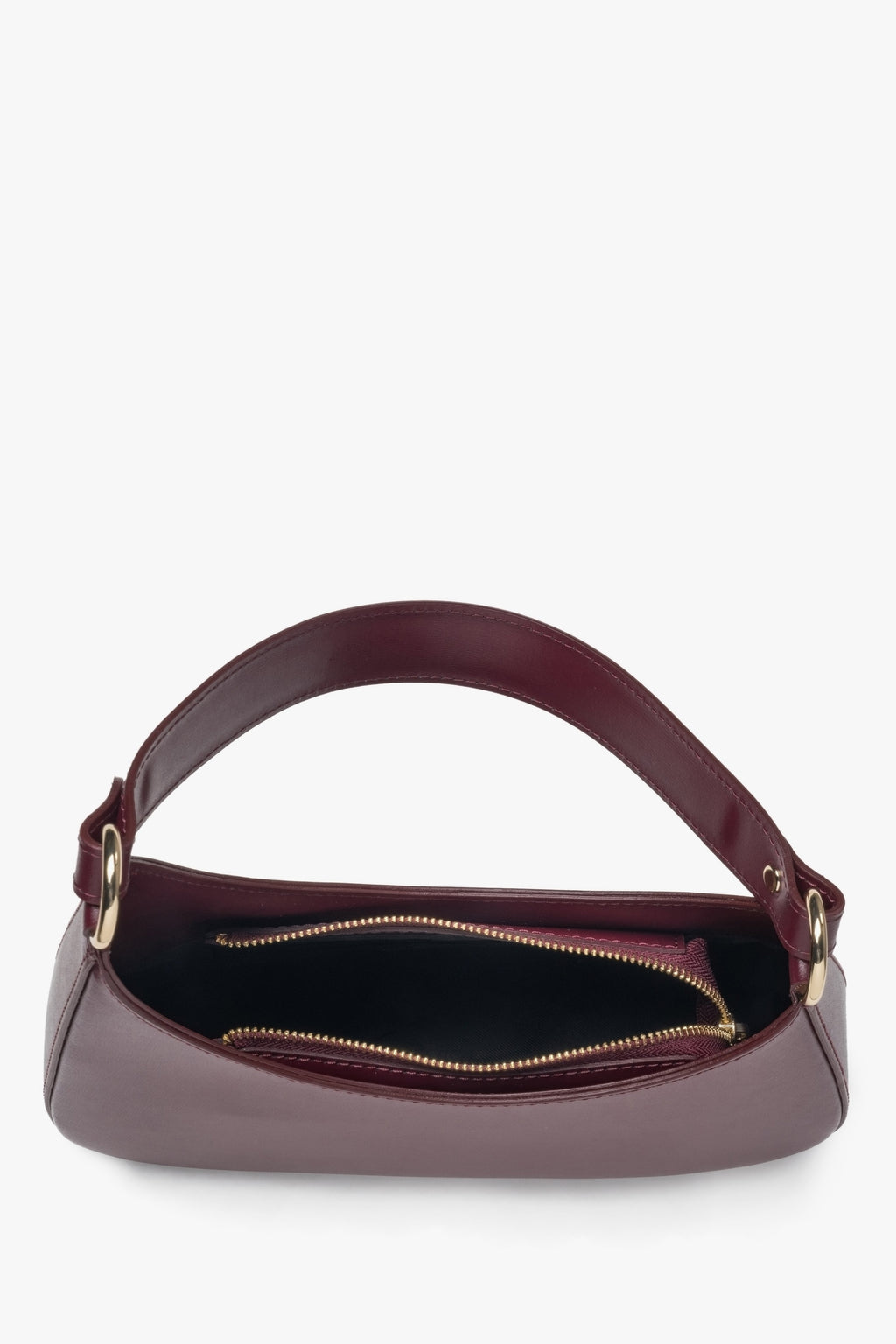 Damska torebka typu shoulder bag w kolorze bordowym z włoskiej skóry naturalnej - zbliżenie na wnętrze modelu.